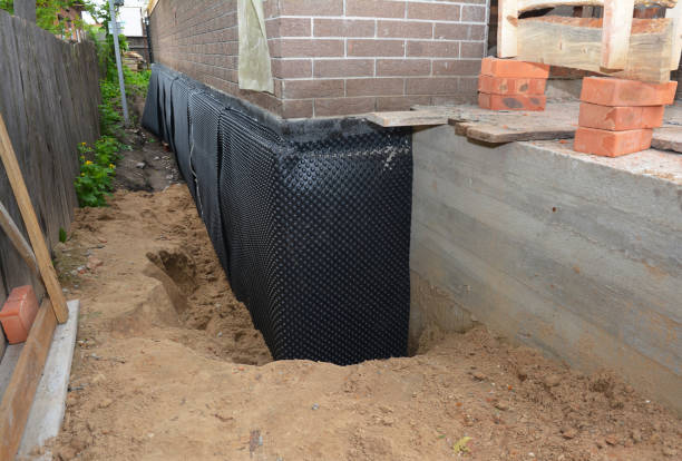 Happy homeowners after waterproofing job in Paw Paw